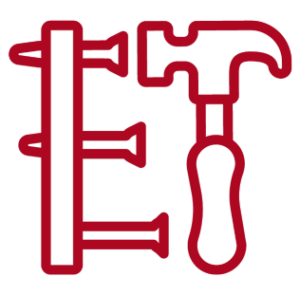 A red hammer driving nails into a board.
