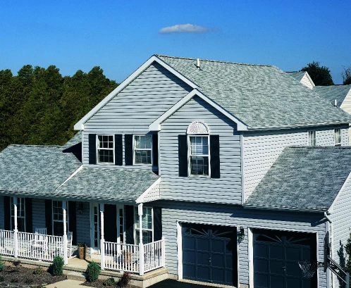 A Kansas City home with a new gray asphalt shingle roof installed by Bill West Roofing