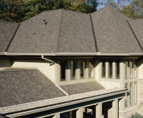 A home in Kansas City with many different ridges and valleys on the roof with new shingles installed by Bill West Roofing.