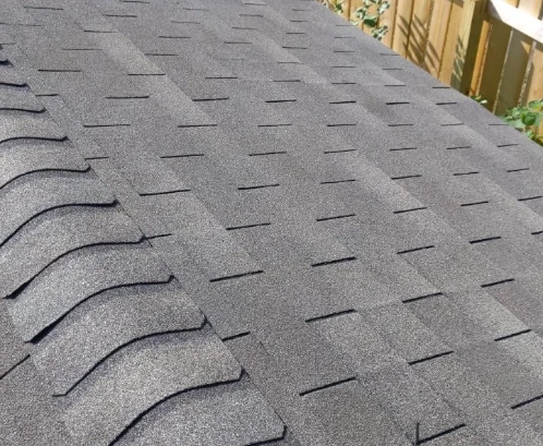 A Kansas City home with a new asphalt shingle roof and a ridge vent installed by Bill West Roofing.